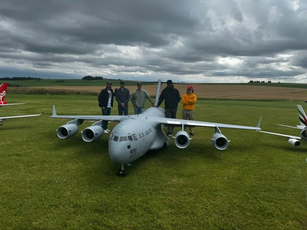 Large-scale C-17 Globemaster III industrial model on display with engineering team — Brosinger Industries